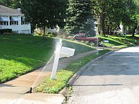 sprinkler hitting a mailbox