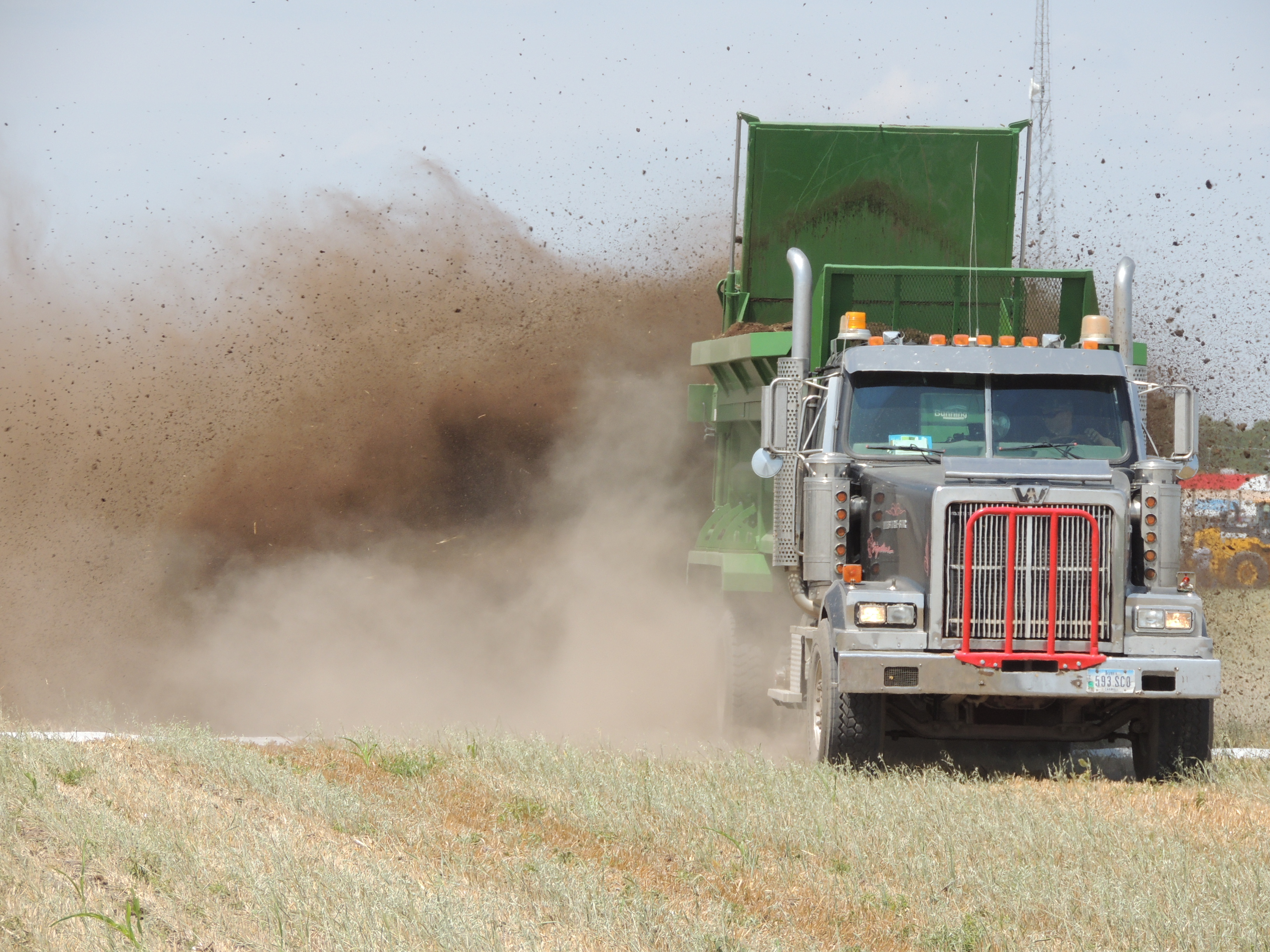 truck spreading manure