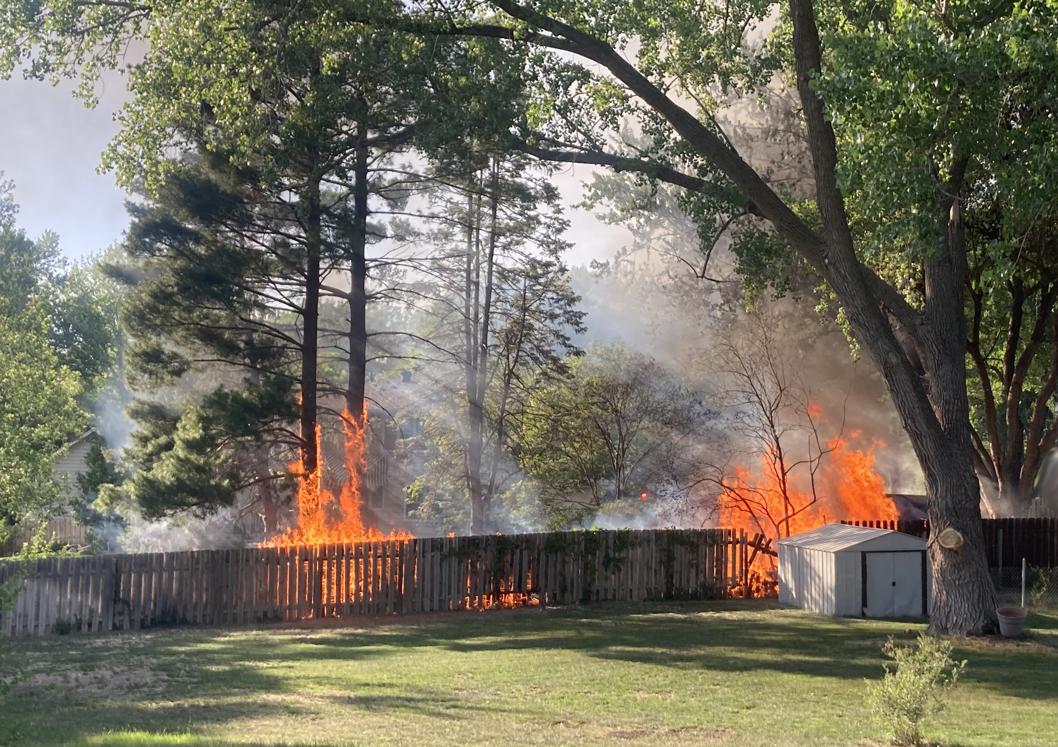 Fire on a fence in a neighborhood. Image courtesy of Sarah Browning