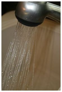 Water spraying from a faucet