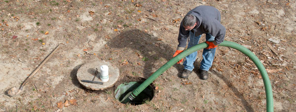 Man pumping a septic tank