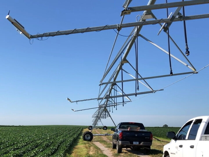 Thermal infrared sensors mounted on the center pivot irrigation system for monitoring canopy temperature.