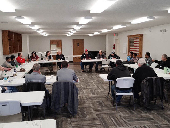 Meeting participants seated in a U-shaped table arrangement during the Shell Creek Watershed workshop, discussing conservation successes and future research needs
