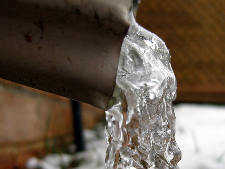 frozen water on the end of a pipe