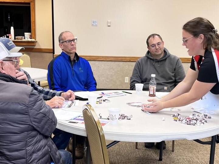   Leslie Johnson uses a mixture of candy to demonstrate the importance of collecting a good representative manure sample at the âSaving Money by Using Manureâ workshop in West Point, Neb. Photo credit: Midwest Messenger