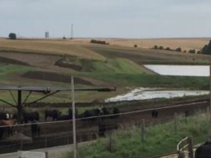 Managing an open lot runoff holding pond during wet weather requires vigilance in monitoring and managing pond levels.