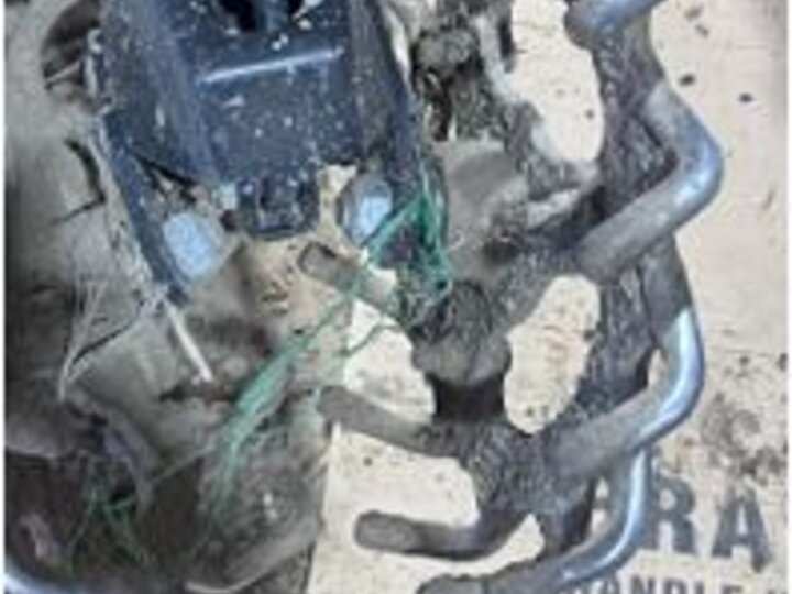 Plastic wrapped around planter closing wheels 