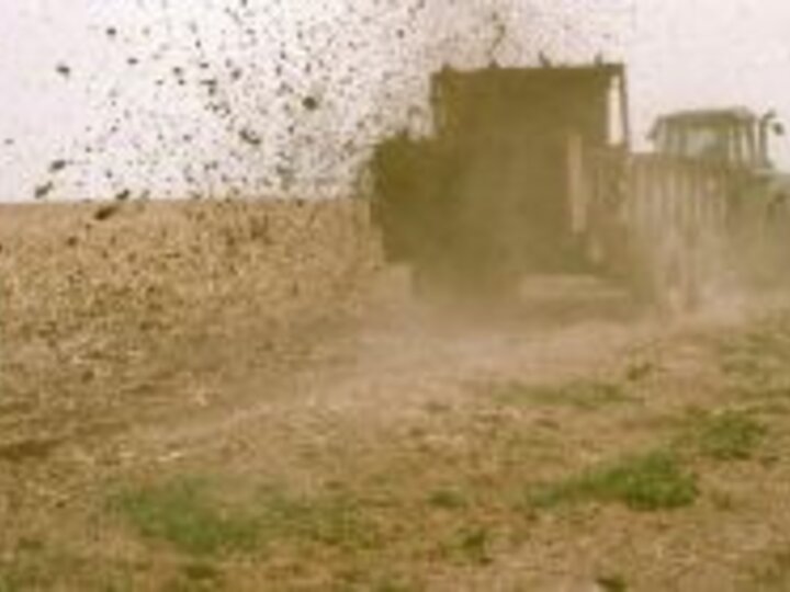 a truck kicking up dirt