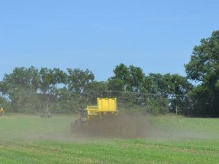 Spreading manure solids on a field