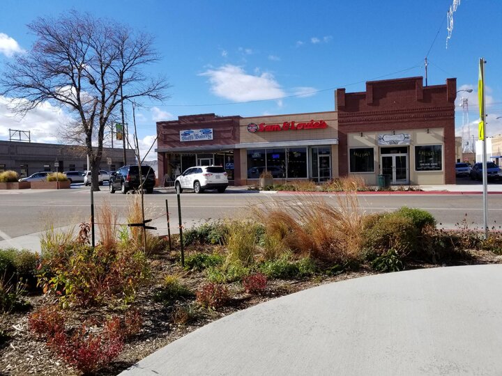 a garden in front of a restaurant