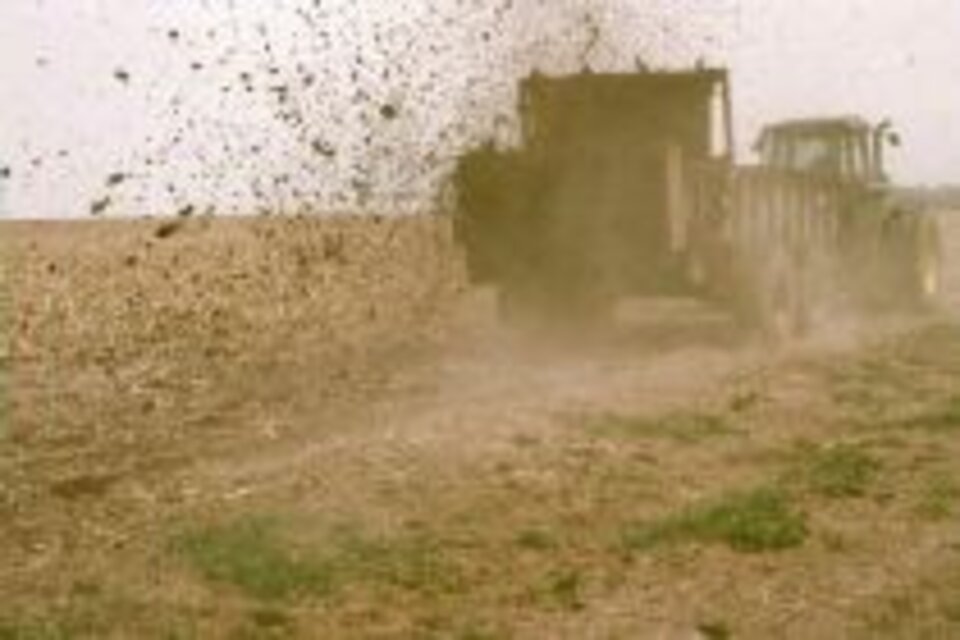 a truck kicking up dirt