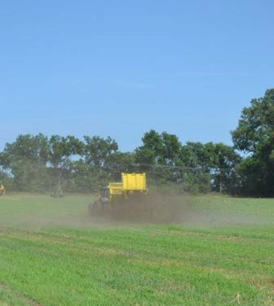 Spreading manure solids on a field